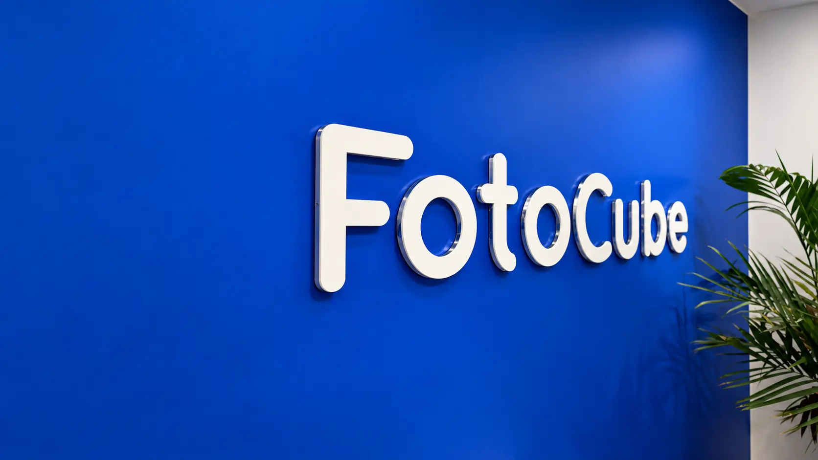FotoCube dimensional lettering on the blue wall of an office